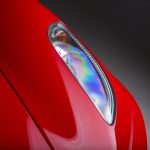 a-closeup-shot-of-the-headlights-of-a-modern-red-c-2026-01-11-10-11-07-utc